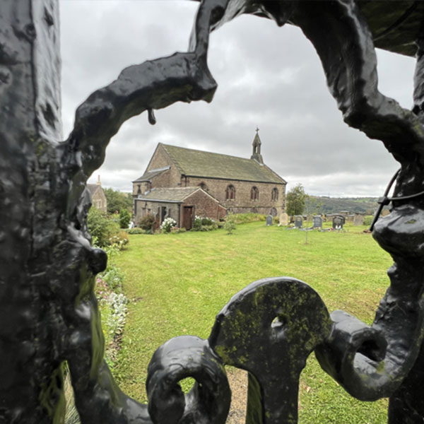 image of a church through some railings